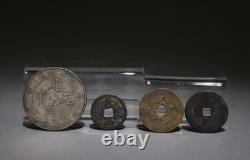 A Set of One Silver Coin and Three Bronze Coins