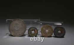 A Set of One Silver Coin and Three Bronze Coins